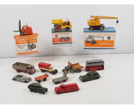 A group of boxed and unboxed DINKY diecast vehicles to include a 14C Fork Lift, 562 Dumper Truck and 571 Coles Mobile Crane -