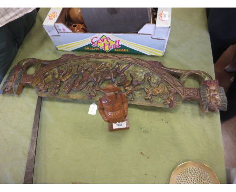 A carved Polychrom Plaque depicting figures in battle 34in, and a carved figure of a portly gentleman 10in H