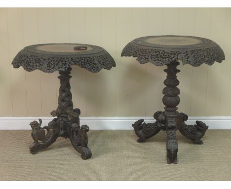 Two Eastern pierced and carved Tables with circular tops on carved tripod bases, 2ft 5in diam