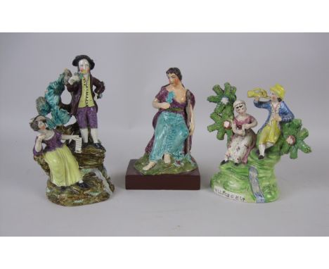 Three early Staffordshire Figures playing musical instruments on rustic supports, A/F