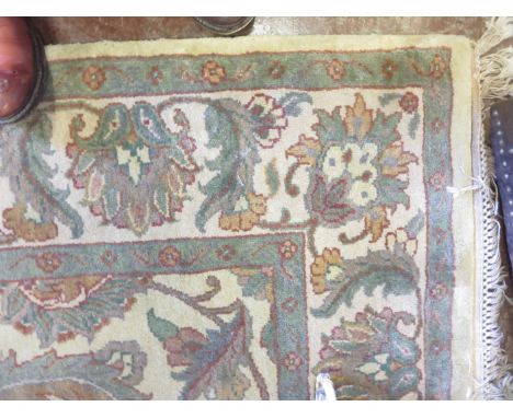 An Indian Jaipur hand knotted wool pile Carpet with floral design on a camel ground, 8ft x 5ft