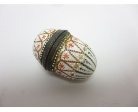 An enamel egg shape Nutmeg Grater with star and arrow friezes, gilt metal mounts, approx 1 3/4in