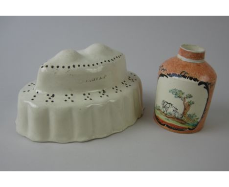 A late 18th Century creamware oval Mould with pierced holes, fruit decoration to interior, 7 1/2in, impressed marble and a cr