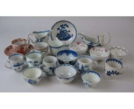 A collection of early Worcester and other English blue and white Tea Bowls, Coffee Cups, two Jugs, Saucers, New Hall Tea Bowl