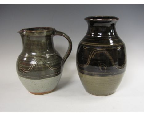 Ray Finch. A Jug and bottle-shape Vase, both with part tenmoku glaze and wiped design. The jug (c1980’s) impressed with Winch