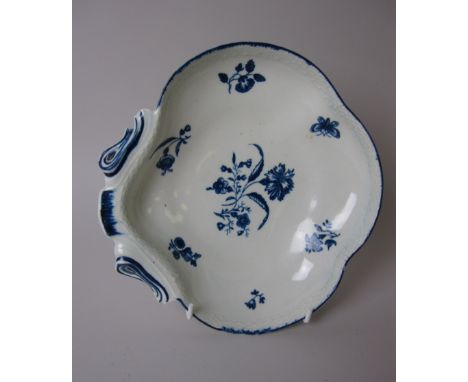 An early Worcester blue and white scallop shaped Dish with moulded basket weave edge, floral and insect design