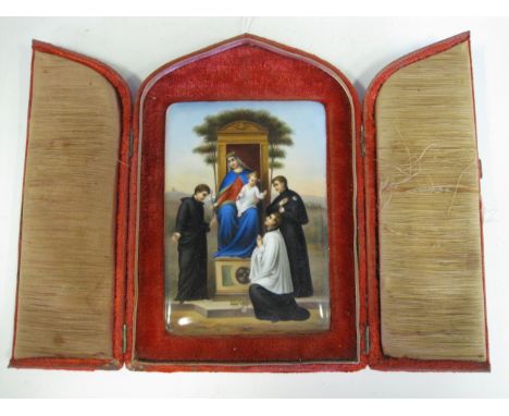 A porcelain oblong Plaque of religious scene with priest kneeling at foot of Mother and Child, in a folding red cloth case, p