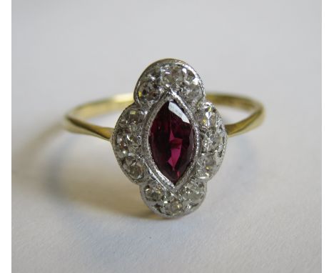 A Ruby and Diamond Cluster Ring millegrain-set marquise-cut ruby within a frame of eight-cut diamonds, stamped 18ct, ring siz