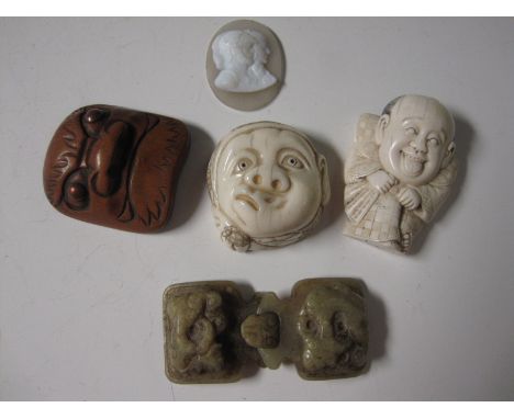 A Tasse type oval Cameo, a Chinese jade Buckle, two carved ivory Netski and a carved wood Netsuke of a mask