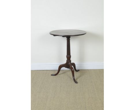 An 18th Century oak Pillar Table with circular top on turned column and tripod base, 21in