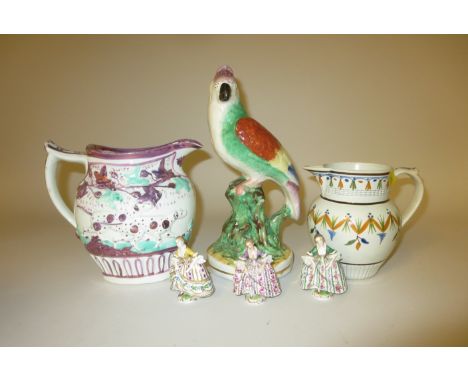 A Prattware Jug with polychrome decoration, a 19th Century pink lustre Jug moulded hunting dogs, Staffordshire Parrot with pa