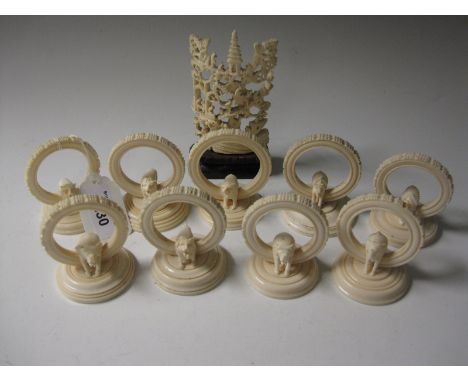 Nine carved ivory Cocktail Stick Holders, carved with African wildlife and an oriental ivory Carving