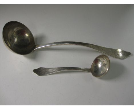 A Victorian silver Soup Ladle and Sauce Ladle with trefoil ends, engraved crest, rat tail bowls, Edinburgh 1900, maker: Hamil