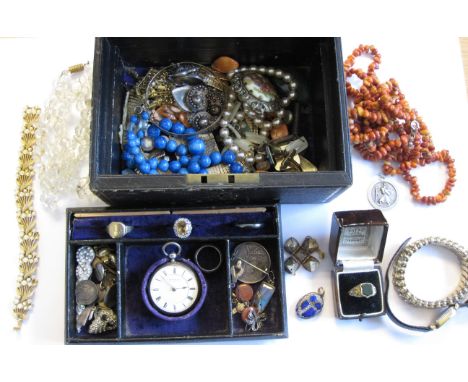 A black Jewel Box containing silver Fob watch, Victorian coin Brooch, various Necklaces, a Mourning Ring with shield set bloo