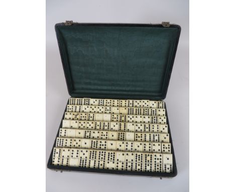 A boxed bone and ebony Domino Set and a Games Compendium including a printed Pope Joan board, Whist Markers, Union Castle Lin
