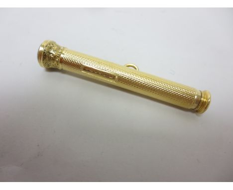A Victorian 18ct gold cased Extending Pen with engine turning, the seal end engraved initials, Birmingham 1887, maker: M.W & 
