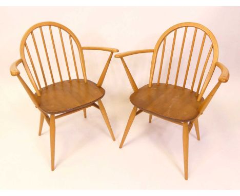 A pair of 1960s Ercol blond elm model 370A stickback elbow chairs, each on turned tapering supports, w.61.5cm 
