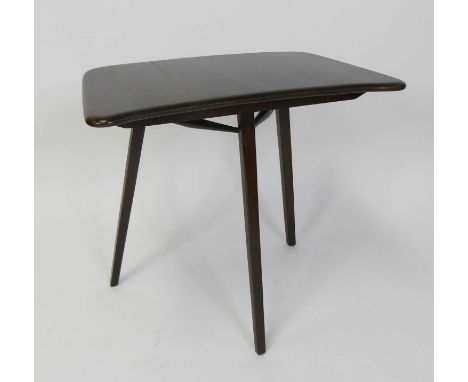 An Ercol dark elm table extender or occasional table, model No. 265, of slightly curved form, on tapering supports, h.72cm, w