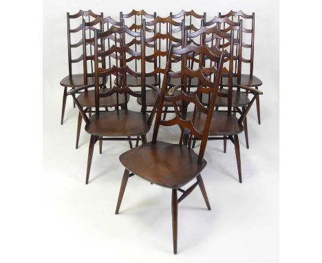 A set of ten Ercol dark elm dining chairs, model 496 and 496A, each with shaped laddered backs, dished seats, and on typical 