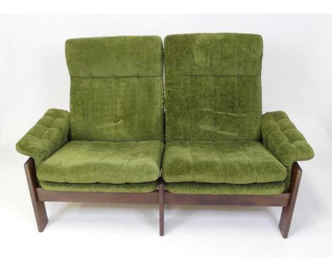 Skippers Furniture - a 1970s hardwood framed two-seater sofa, having green cloth fabric upholstery, with squab cushion backs 