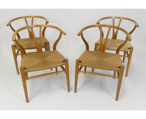 After Hans Wegner - a set of four contemporary beech 'Wishbone' tub elbow chairs, each with rush seats, w.54cm Each structura