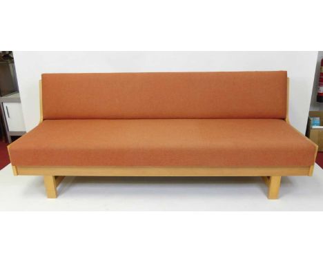 Hans Wegner (Denmark, 1914-2007) for Getama - a beech laminate long sofa bed, fabric upholstered, with hinged folding mechani