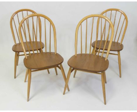 A set of four Ercol blond elm Windsor dining chairs, each raised on typical turned supports, w.45cm