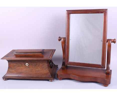 A 19th century rosewood sarcophagus tea caddy with ring handles, 14" wide, and a mahogany toilet mirror