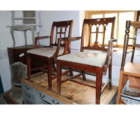 Six mahogany dining chairs with floral tapestry seats, on square tapered supports