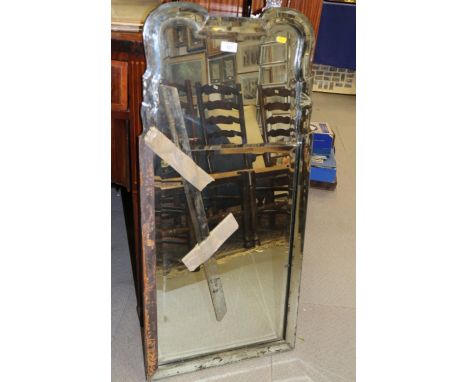 An early 20th century "Venetian" serpentine mirror with bevelled borders, 19" wide(damages) 102 cm high Additional pictures o
