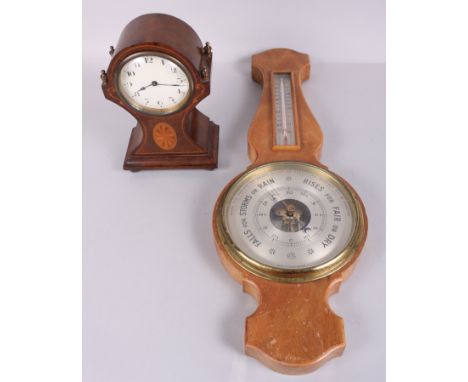 An Edwardian mahogany cased mantel clock with white painted dial and Arabic numerals, 8 1/4" high, and an oak cased barometer