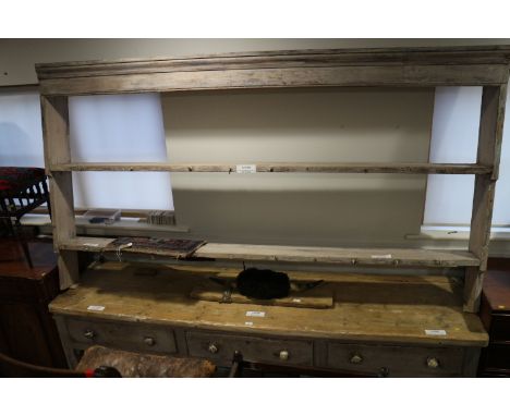 A 19th century painted dresser with oak top, fitted three drawers over lower shelf, on stile supports, 97" wide