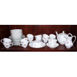 A Hutschenreuther porcelain floral decorated part teaset for twelve