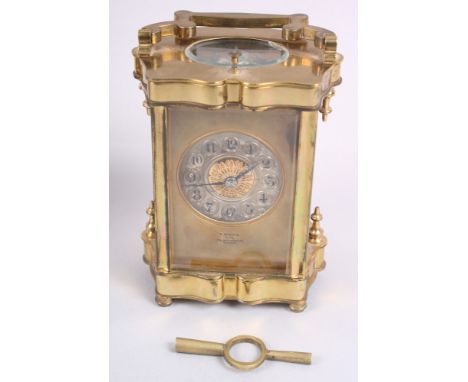 A brass and glass cased repeater carriage clock with silvered dial, Arabic numerals inscribed "E White Paris, 32 Haymarket, L