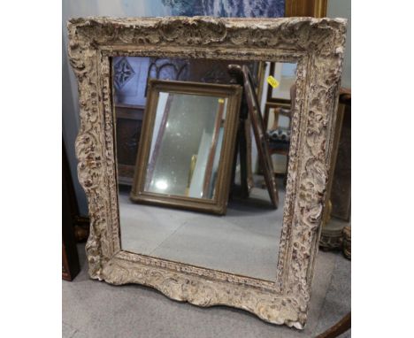 A rectangular white painted ornate mirror, 19" x 15 1/2"