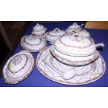 A quantity of early 20th century china, including a turkey platter, tureens, ladles and under trays