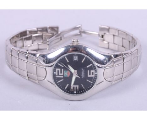 A gentleman's Tag Heuer "Professional" quartz stainless steel wristwatch with Arabic and baton numerals, on black dial