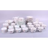 A collection of Villeroy & Boch "Petite Fleur" pattern side plates, saucers and teacups with