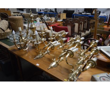 A brass ceiling light and collection of matching wall lights