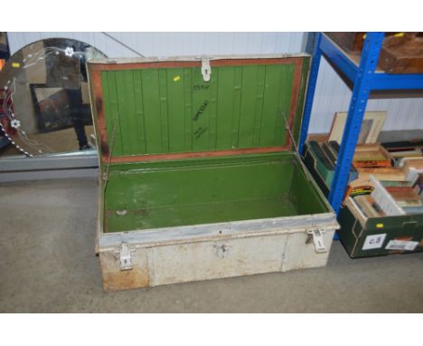 A white painted metal trunk