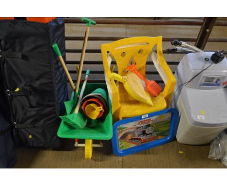 Two children's chairs; Thomas The Tank Engine tray; wheelbarrow; bucket and spades