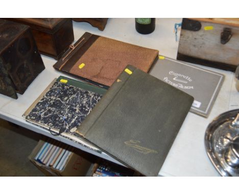 A cigarette card album; post-card album; and two albums containing photographs and prints 
