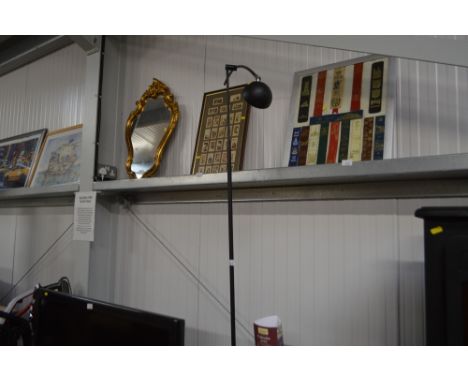A floor standing reading lamp