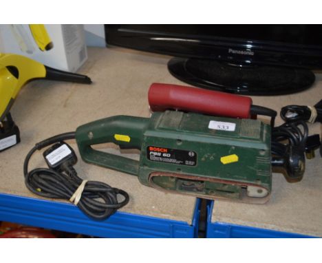 A Bosch belt sander; together with a Power Devil jig saw