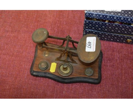 A set of postage scales and weights