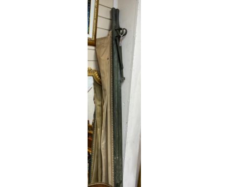 A vintage military folding canvas stretcher.