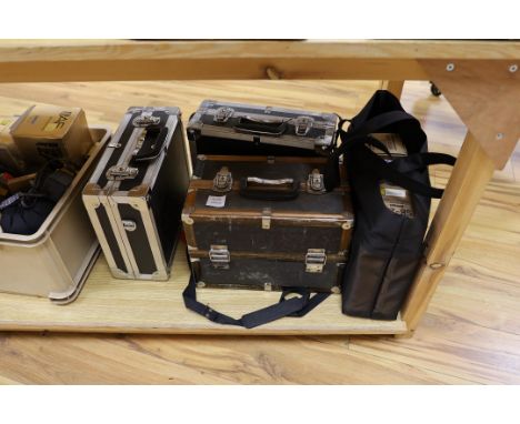 A large quantity of various camera equipment, including a Nikon D300 SLR camera body a Nikon F4 body and various lenses