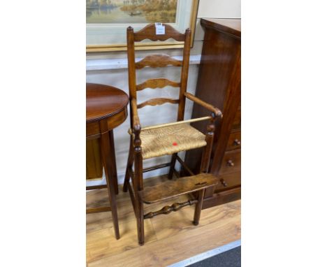 An early 19th century ash and elm ladder back rush seat child's high chair, height 104cm