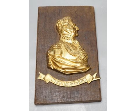 A gilt metal ‘Wellington’ plaque on wooden panel, 30 x 19cm