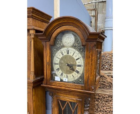 A modern oak longcase clock, with "Tempus Fugit" in the arch, height 195cm